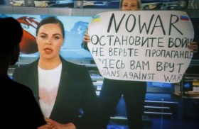 Journalist Marina Ovsiannikova protesting Russian disinformation on state television