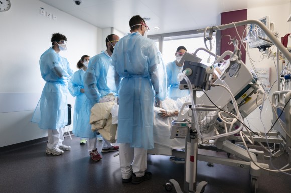 Staff attend to a Covid patient at Lausanne University Hospital (CHUV) on January 11, 2022.