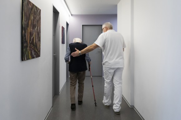 Older doctor with patient