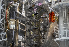 Assembly of a section of ITER s donut-shaped vessel inside the nuclear fusion reactor facility in the south of France.