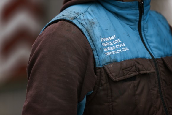 person wearing a jacket with label civilian service