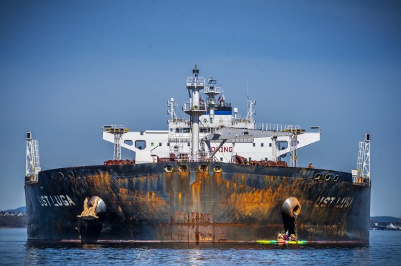 Greenpeace activists protest in front of Russian oil tanker.