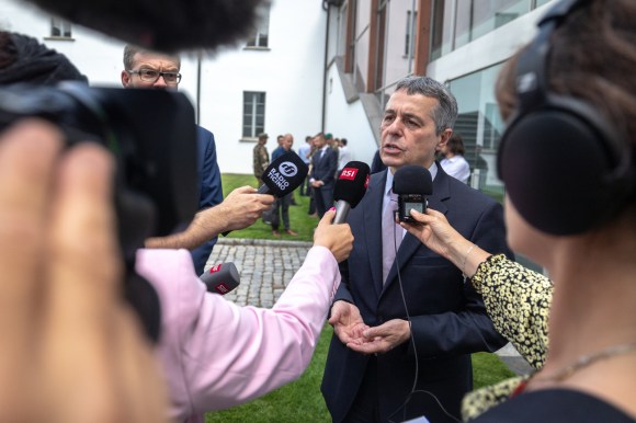 Foreign Minister Cassis talking to journalists