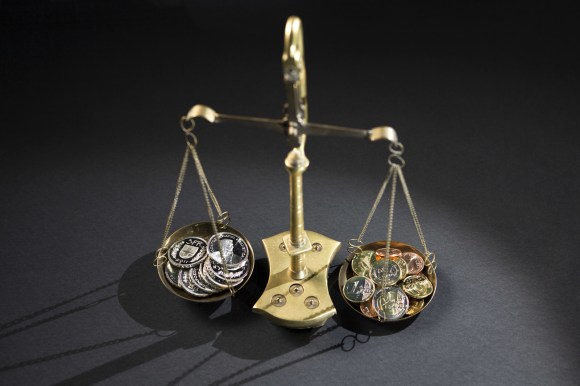 Scales weigh up Swiss francs and euros