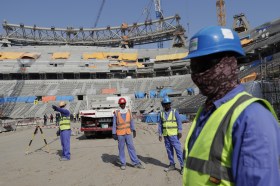 Workers building a football stadium in Qatar