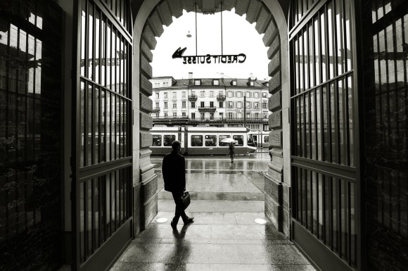 Person stands in Credit Suisse doorway
