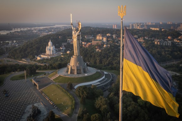 ukrainian flag over city of kyiv