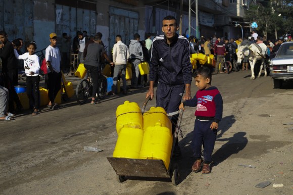 Palestinians collecting water