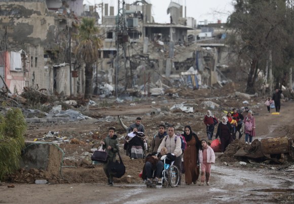 Palestinians in Gaza amid rubble